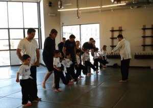 kids and parents' martial arts classes shin to calf sweep