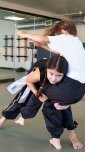 Wushu_III_dojo_double_leg_take_down_from_standing