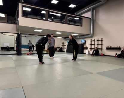 two senior studetns bowing to one another before sparring