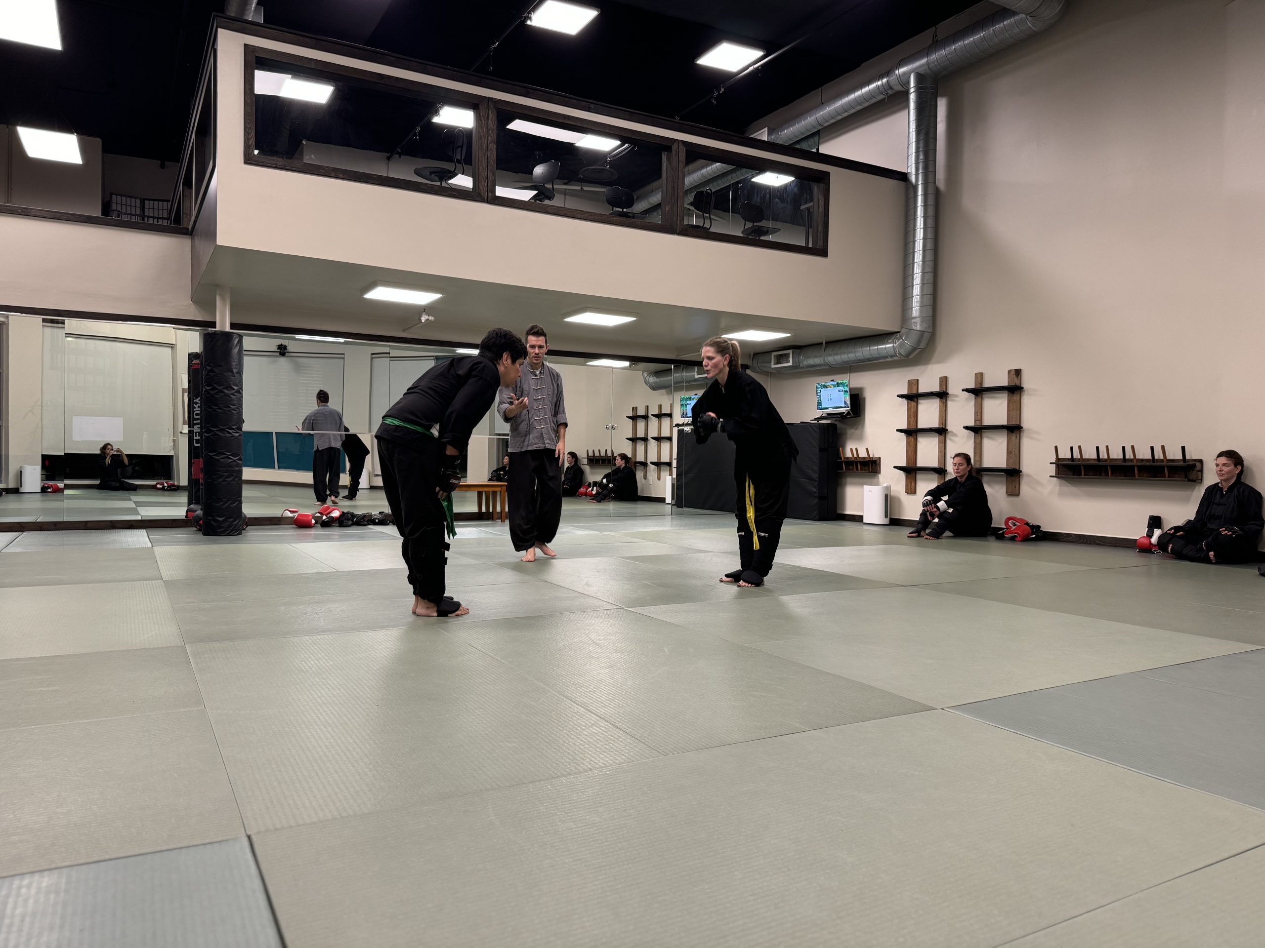 two senior studetns bowing to one another before sparring